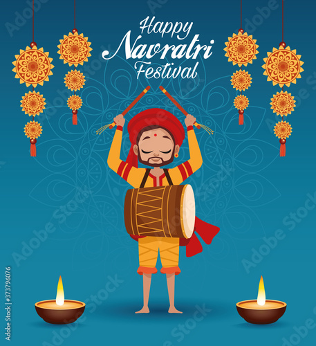 happy navratri celebration card lettering with man playing drum and candles