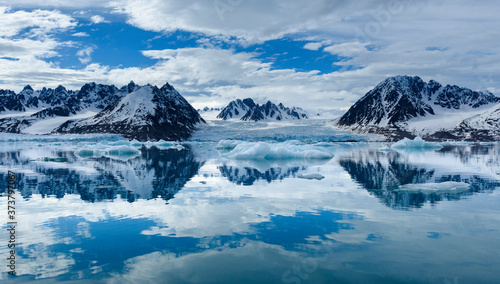 Norway, Svalbard, Spitsbergen. Monacobreen Glacier and mountain reflections.