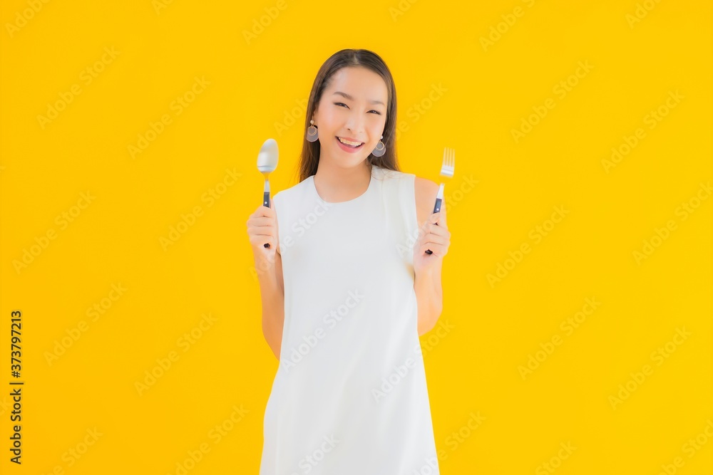 Portrait beautiful young asian woman with fork spoon