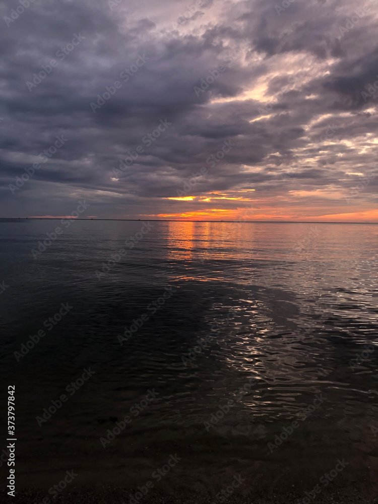 Beautiful sunset sky over the sea background Beautiful sunset sky over the sea background
