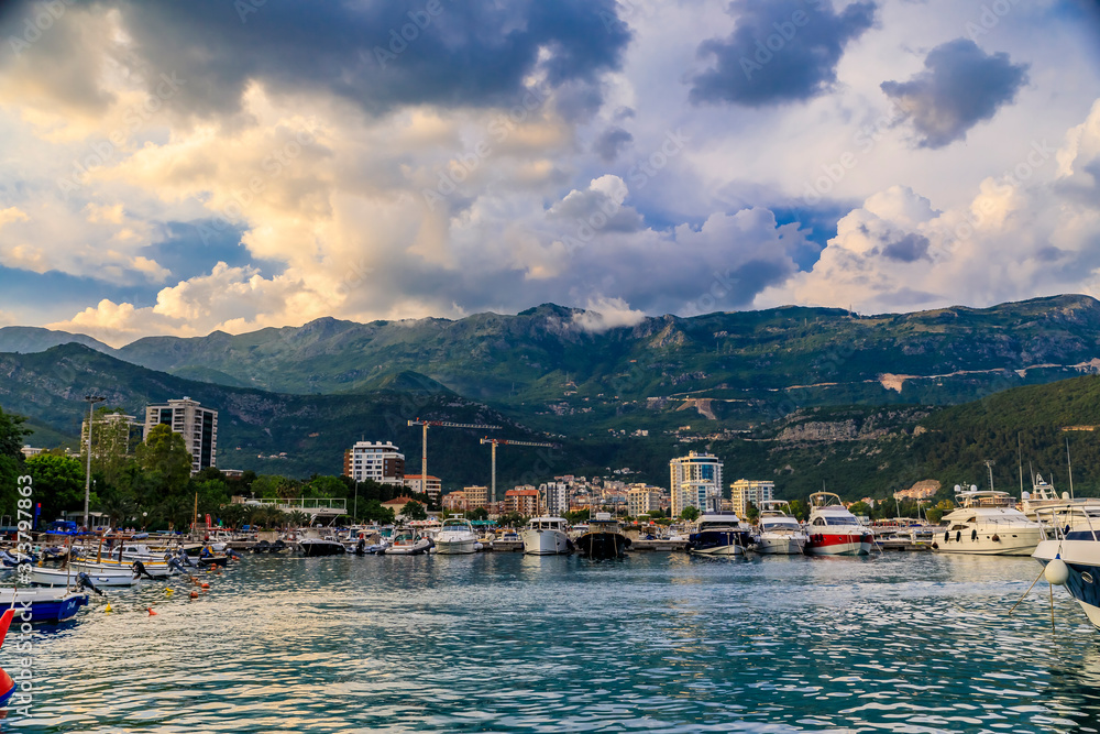 Boats in the port and marina by the Old town in Budva Montenegro on the Adriatic Sea at sunset