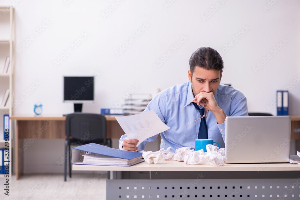 Sick male employee suffering at workplace Sick male employee suffering at workplace