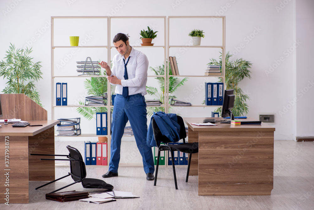 Young male employee businessman at workplace Young male employee businessman at workplace