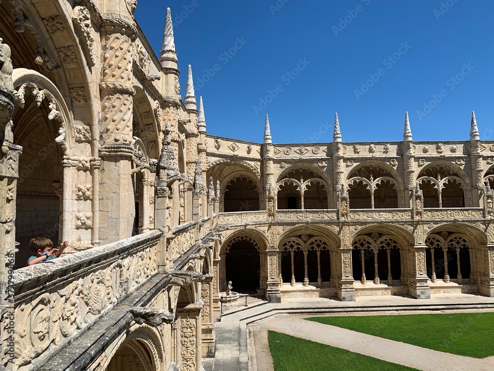 Inside the beautiful monastery of Jeronimos in Belem,  with the beautiful green garden, Lisbon, Portugal