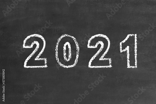 2021 bold numbers in handwritten thin stroke white chalk brush font, stock vector illustration clip art design element on grunge black chalkboard background for calendar, poster, flyer, card