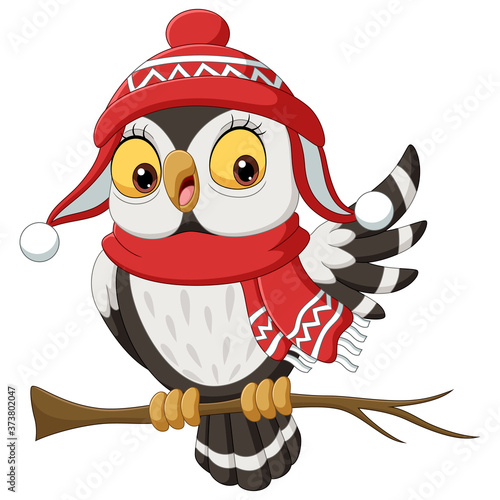 Cute owl cartoon wearing a scarf and christmas hat on tree branches
