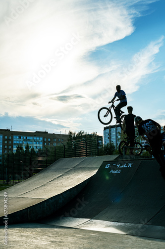 BMX stunt vertical. A professional cyclist Extreme cycling concept. Dert jump. BMX vertical barspin jump. BMX Freestyle Vert Stunt. Halframp. Set Of Skatepark Element photo