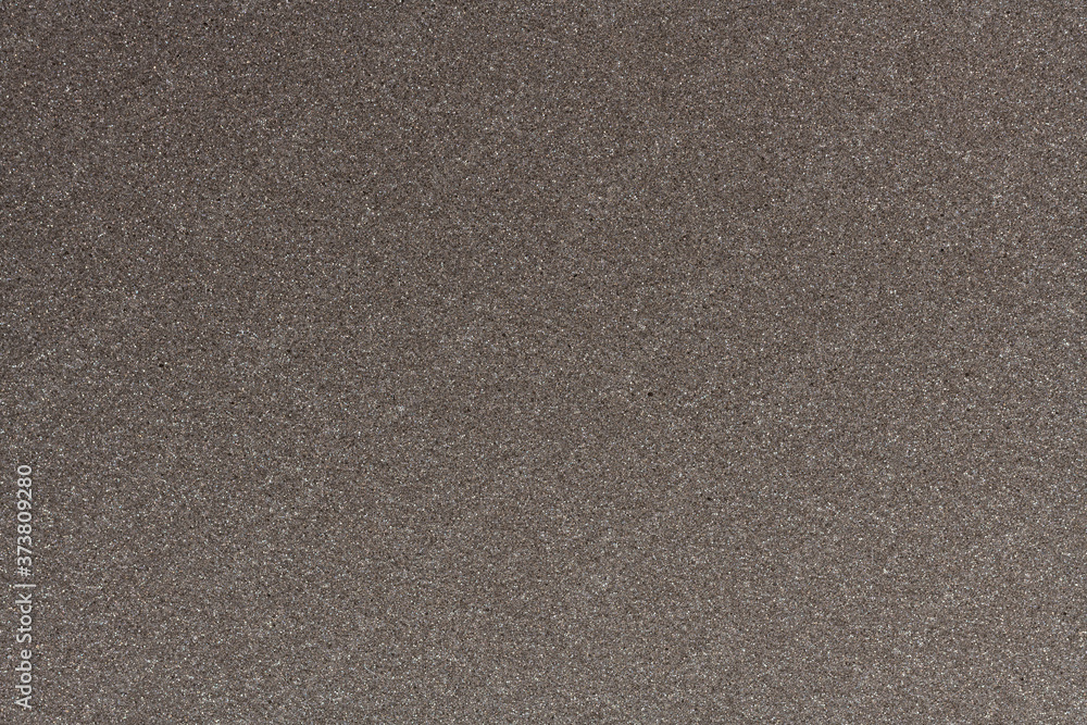 Gray packing material made of synthetic fibers textured background. Gray packing material made of synthetic fibers textured background.