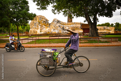 Tricycle and a reclining Buddha
