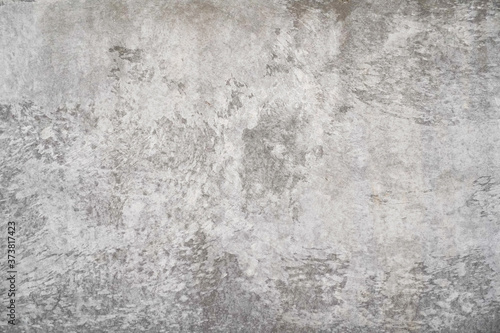 Texture of a smooth gray concrete wall as background or wallpaper. Close up of concrete wall with rough texture. Cement texture.