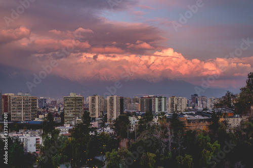 Panoramic view of beautiful cloudscape and sunset sky over Santiago skyline and The Andes Mountains, Chile