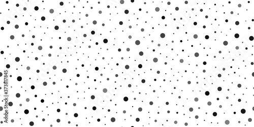 Seamless pattern with random black dots on white background. Vector.