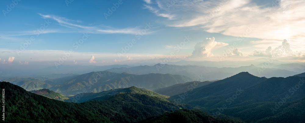 Panorama of mountain views, smooth greenery. Natural atmosphere evening light Bright clouds and sky.