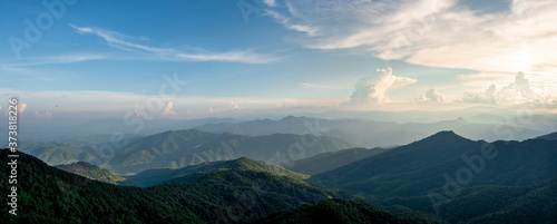 Panorama of mountain views, smooth greenery. Natural atmosphere evening light Bright clouds and sky.