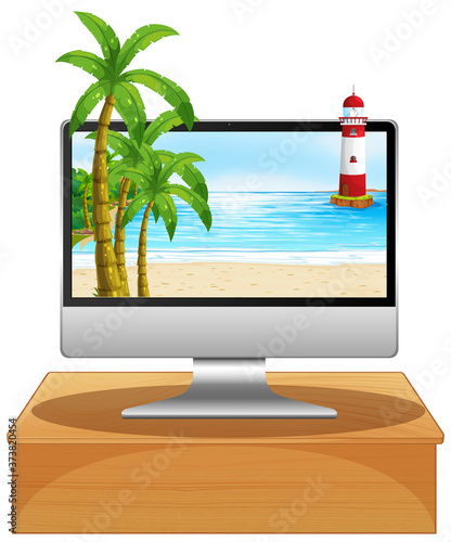 Computer on the table with beach on screen