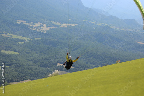 flying paraglider in the alps 5