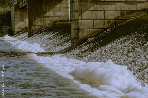 Duotoe image of Channahon dam bridge piers, spillway and  turbulent foaming waters captured from the spillway base
 photo