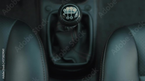 Women's shifting gears on a manual transmission.