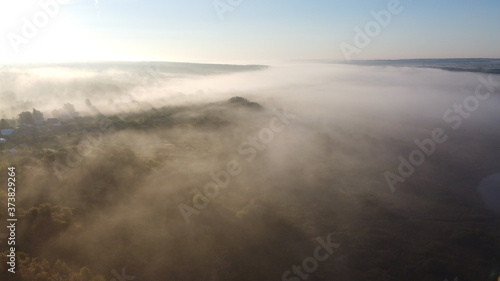 A plume of fog envelops the forest. © Сергей Коптев