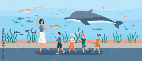 Vector illustration of children with a teacher in an aquarium or oceanarium.
