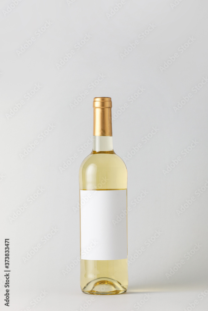 Bottle of wine with blank label on light background. Mockup for design Bottle of wine with blank label on light background. Mockup for design
