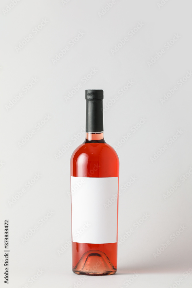 Bottle of wine with blank label on light background. Mockup for design Bottle of wine with blank label on light background. Mockup for design