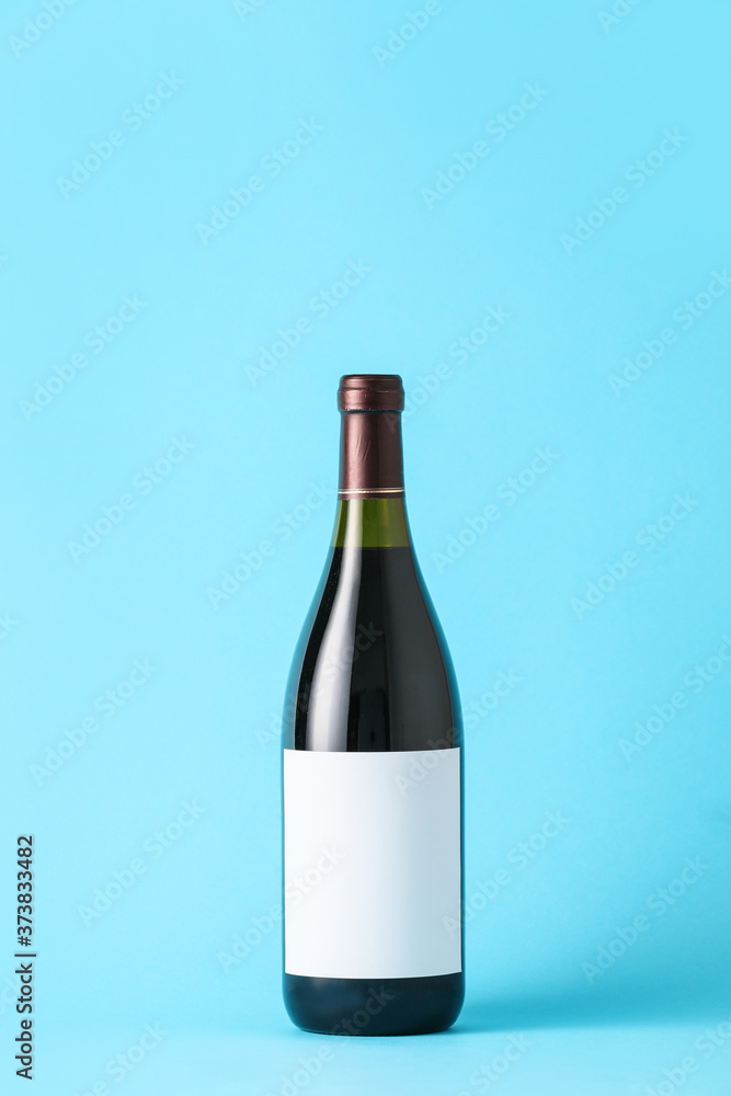 Bottle of wine with blank label on color background. Mockup for design Bottle of wine with blank label on color background. Mockup for design