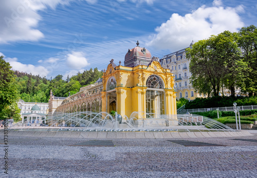 Main colonnade and Singing fountain in the spa center of small town Marianske Lazne (Marienbad) - Czech Republic