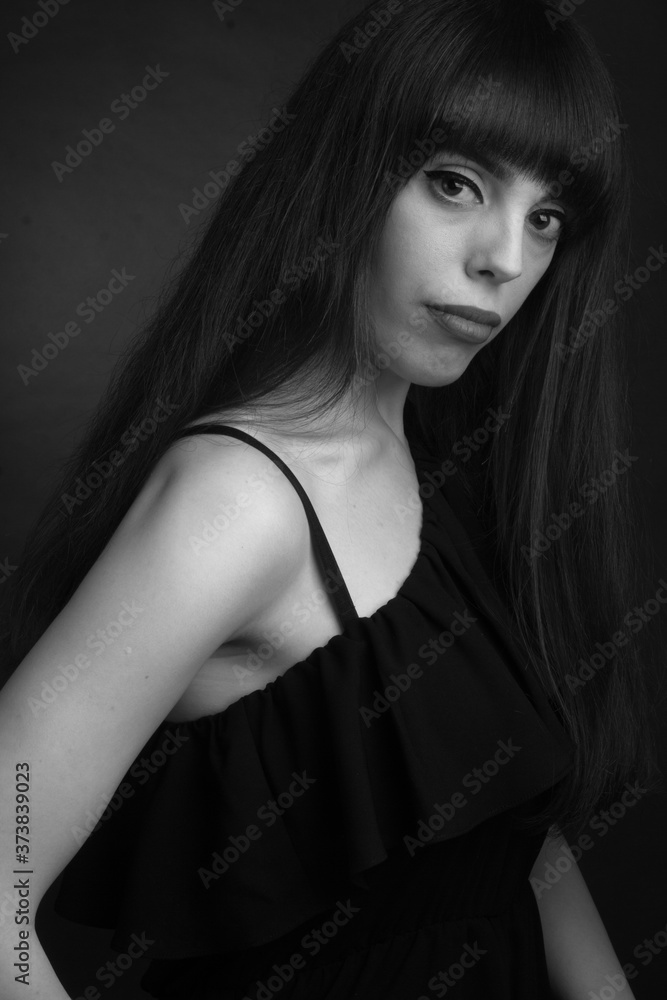 Naklejka premium black and white portrait of brunette with long hair
