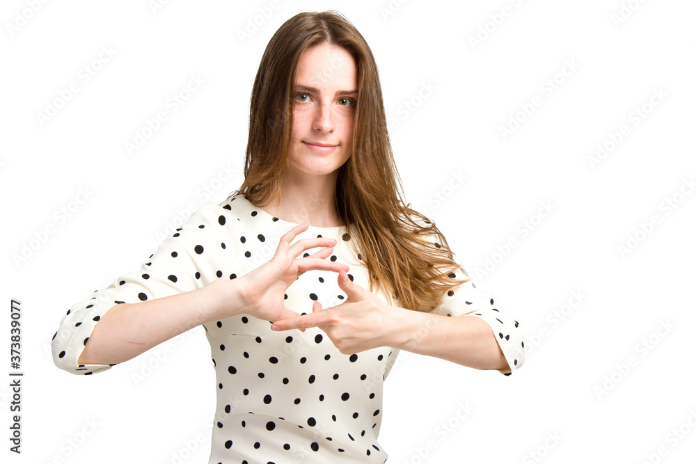 A young woman with long brown hair and a white polka-dot dress. A young woman with long brown hair and a white polka-dot dress.