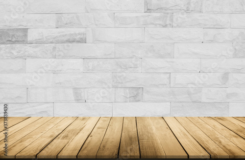 Empty wooden table top on white brick wall background  Design wood terrace white. Perspective for show space for your copy and branding. Can be used as product display montage. Vintage style concept.