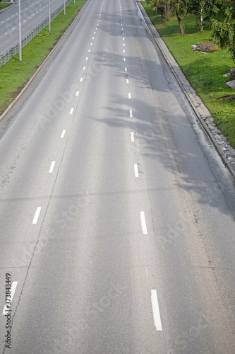 Summer top view of a three lane highway