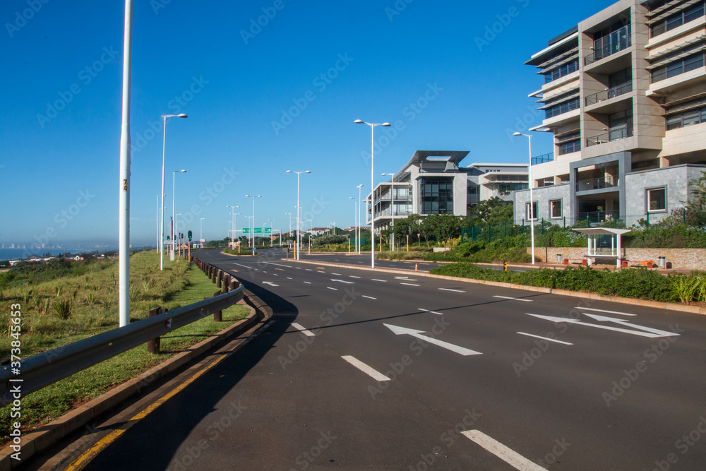 Suburban Tarmac Road Lined with Residential Buildings