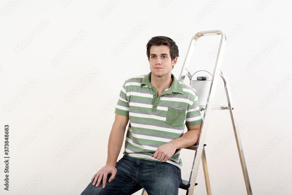 Man sitting on a ladder