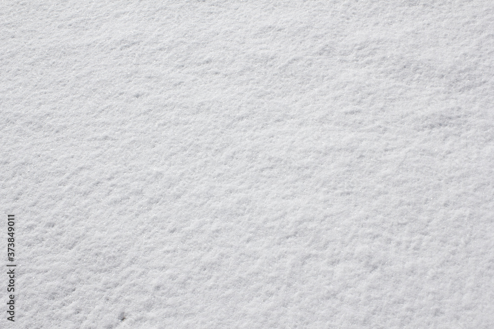 Fototapeta premium Texture of fresh snow covering the ground in winter .