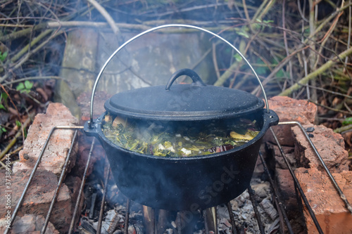 food on a hike in a cauldron green soup