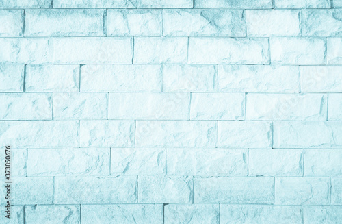 Empty Background of wide blue brick wall texture. Pastel brick wall texture background in room at subway. Brickwork stonework interior, rock old concrete grid uneven horizontal architecture wallpaper.