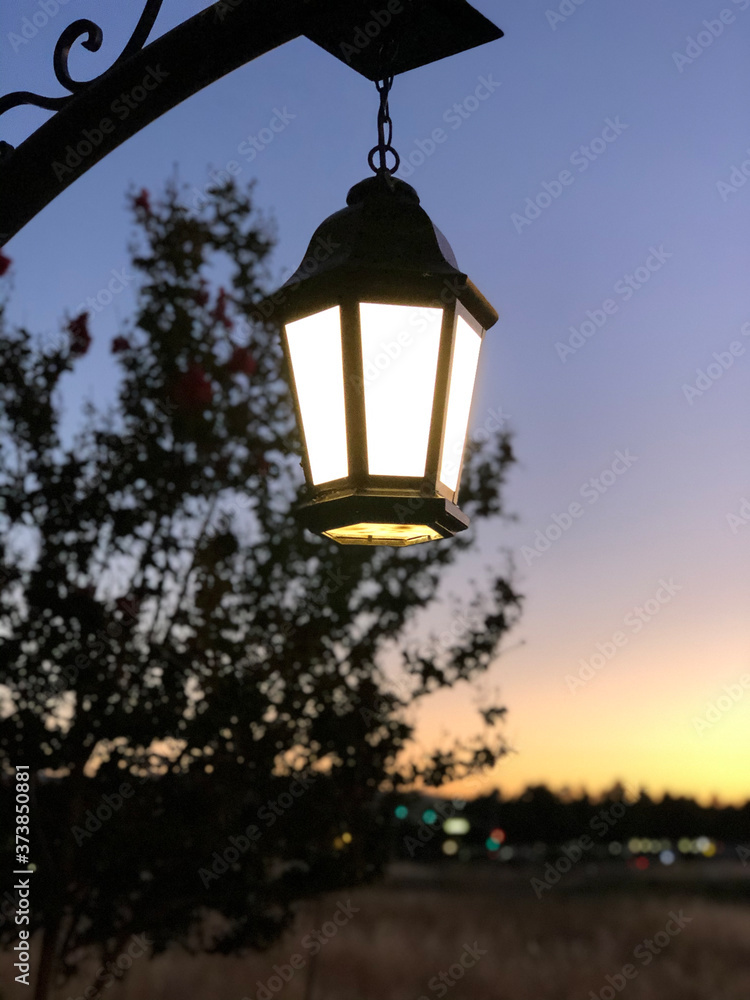 Retro-style street lamp during sunset