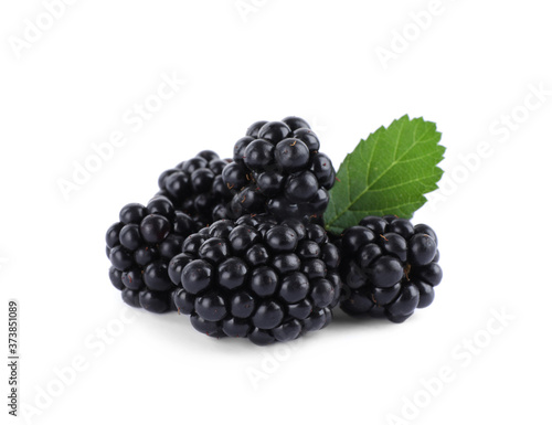 Tasty ripe blackberries and leaf on white background