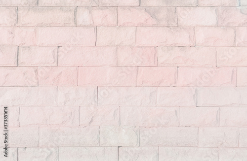 Empty Pink brick wall texture background in the bedroom at lovely. Brickwork stonework interior, rock old clean concrete grid uneven abstract weathered brick design, horizontal architecture wallpaper.