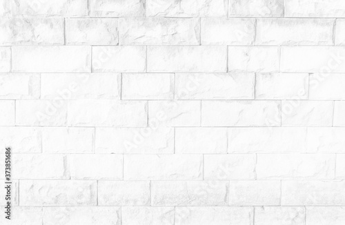 White brick wall texture background in room at subway. Brickwork