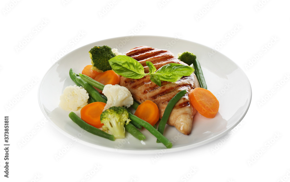 Tasty grilled chicken fillet with green basil and vegetables isolated on white