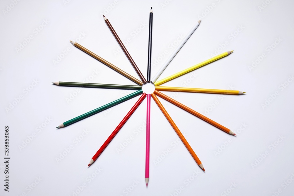 Coloured pencils arranged into a circle
