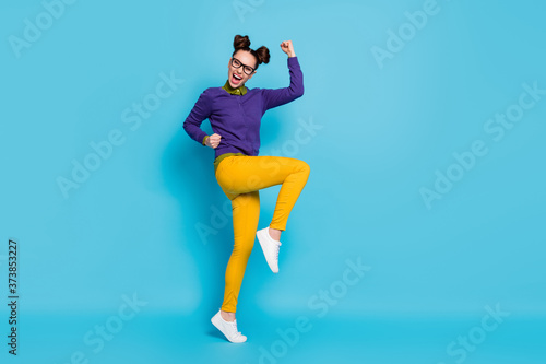Fototapeta Naklejka Na Ścianę i Meble -  Full length profile photo of pretty crazy lady two buns celebrating college graduating a-student excellent degree diploma wear specs shirt pullover pants isolated blue color background