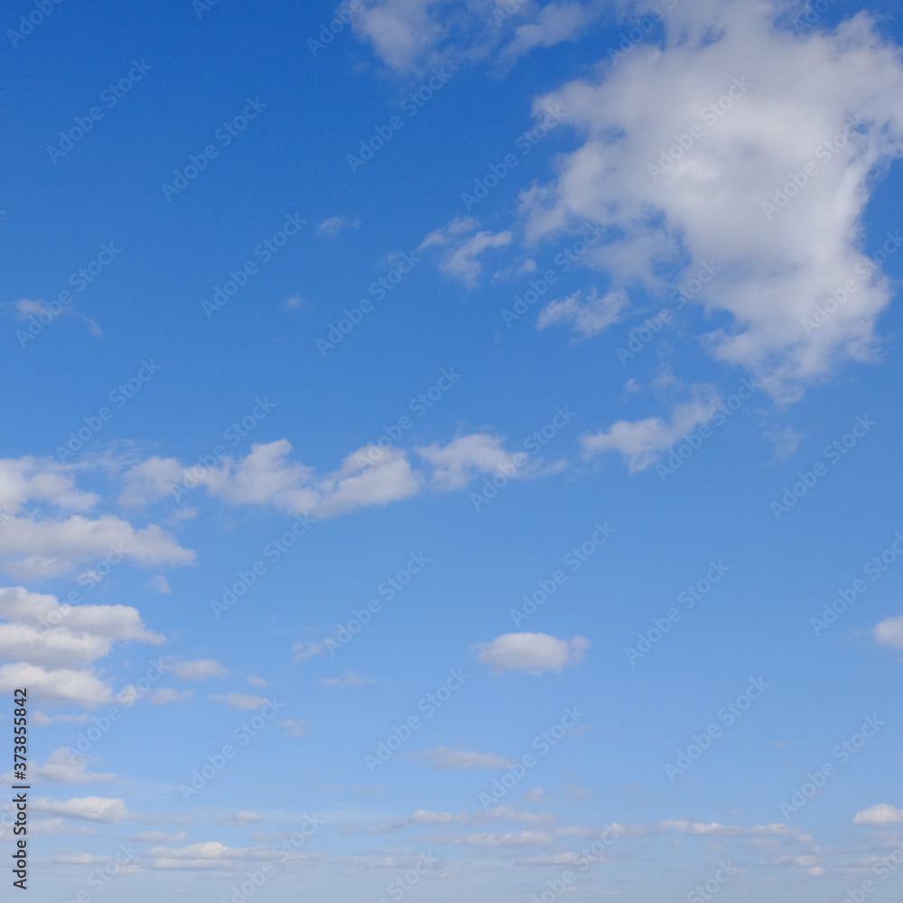 Blue spring sky with white clouds. Beautiful background. Blue spring sky with white clouds. Beautiful background.
