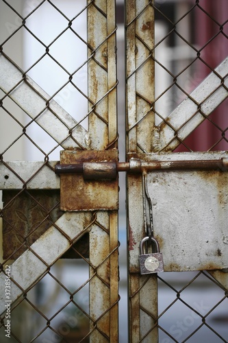Chain link fence with padlock