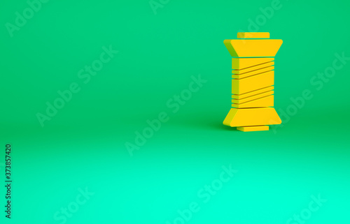 Orange Sewing thread on spool icon isolated on green background. Yarn spool. Thread bobbin. Minimalism concept. 3d illustration 3D render.