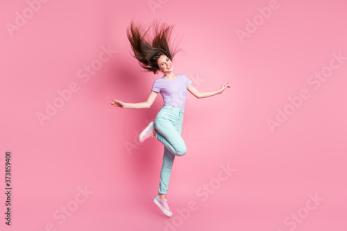 Full length photo of nice pretty lovely cute girl jump enjoy rest relax wear good look clothes gumshoes isolated over pink color background