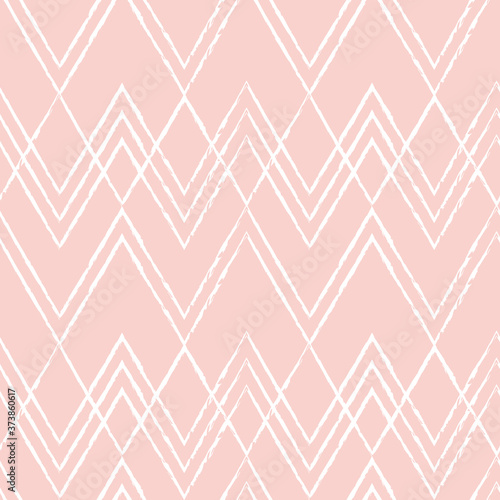 Ikat vector seamless pattern. Chevrons in pastel colors on light background. Modern geometric background in retro style.