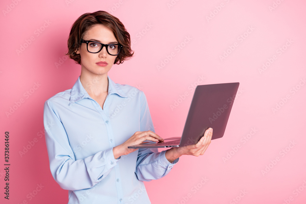 Portrait of her she nice attractive serious smart clever brown-haired girl translator employee hr manager holding in hands laptop agent broker realtor isolated pink pastel color background Portrait of her she nice attractive serious smart clever brown-haired girl translator employee hr manager holding in hands laptop agent broker realtor isolated pink pastel color background